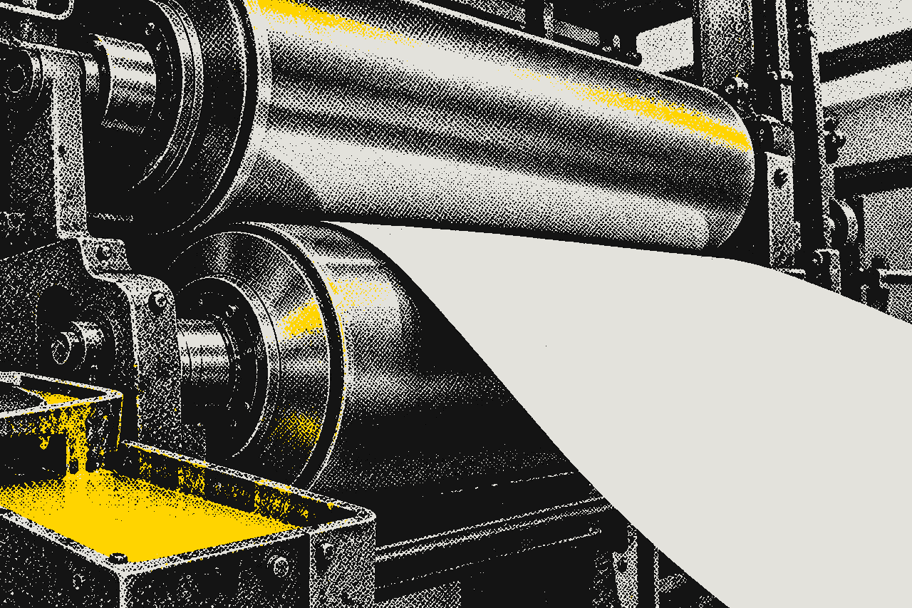 A printing press inking a sheet